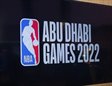 Cartel anunciando los juegos de Abu Dhabi 2022