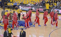 Los Clippers calentando en uno de los partidos jugados en el Oracle Arena